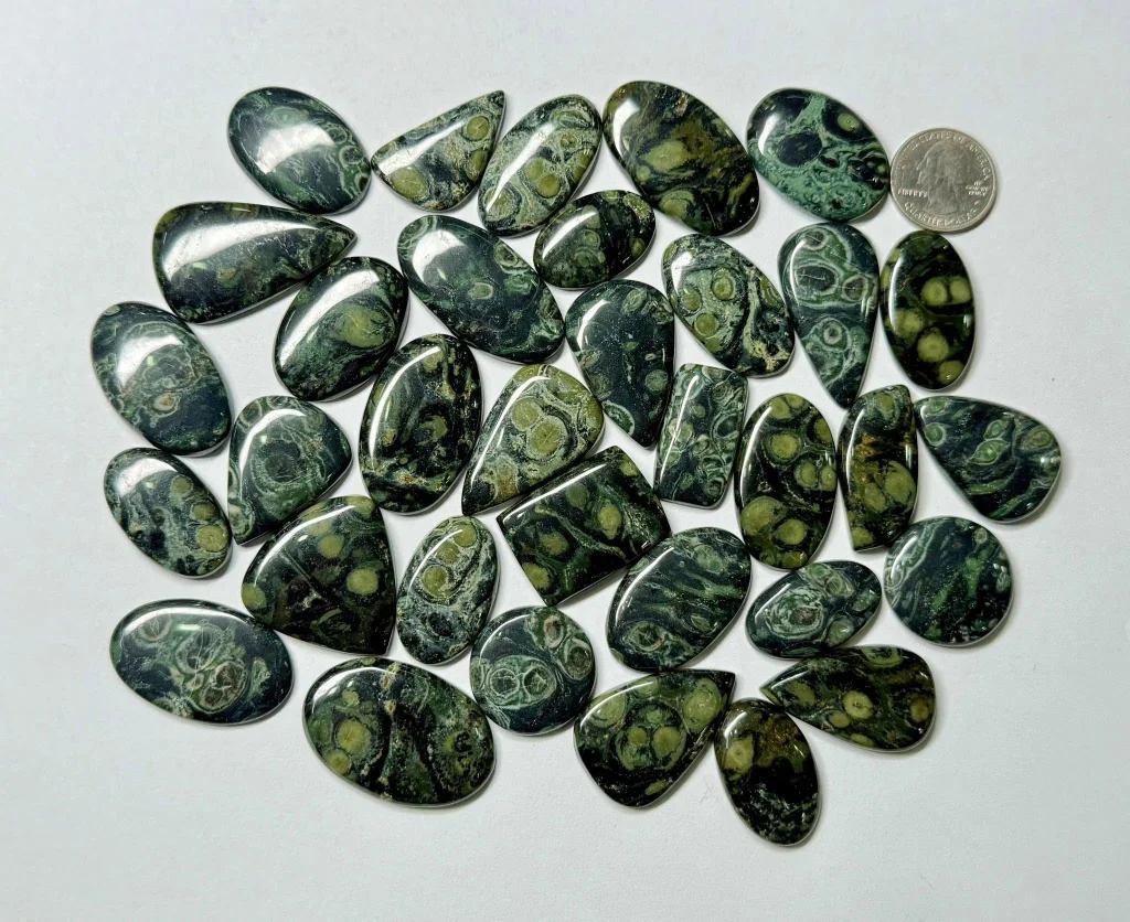Large natural Kambaba jasper focal cabochons showing distinct orbicular crocodile eye patterns and glossy polish for statement jewelry.