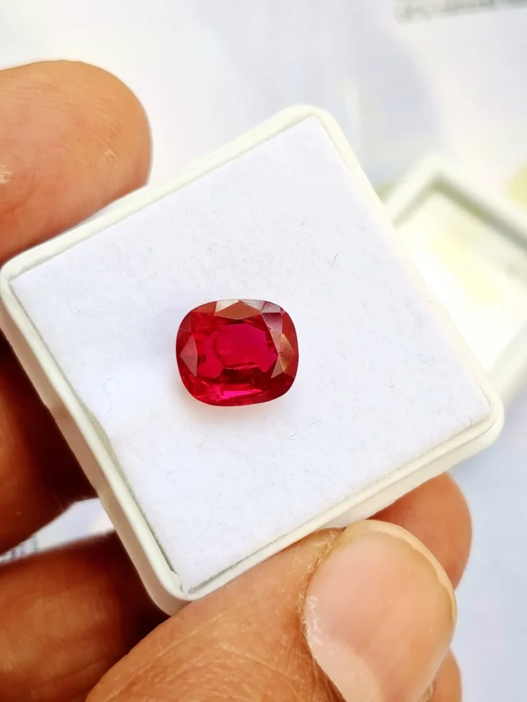 Cushion-cut natural Burmese ruby gemstone showcasing vivid pigeon blood red brilliance.