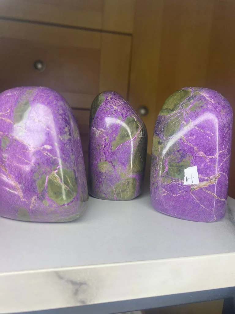 Natural polished stichtite in serpentine freeform standing display stones (Atlantasite) showing vivid purple and green patterns.