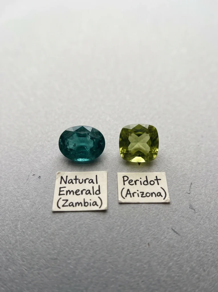 Emerald compared to peridot showing color tone differences